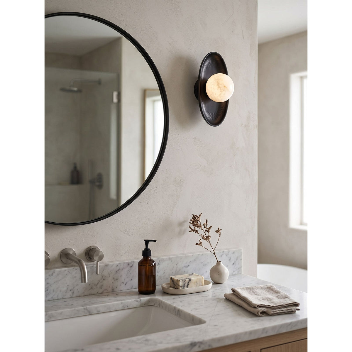 Aosta Disc Alabaster Wall Sconce — additional product view, a stone globe in front of a textured brass disc (view 5)