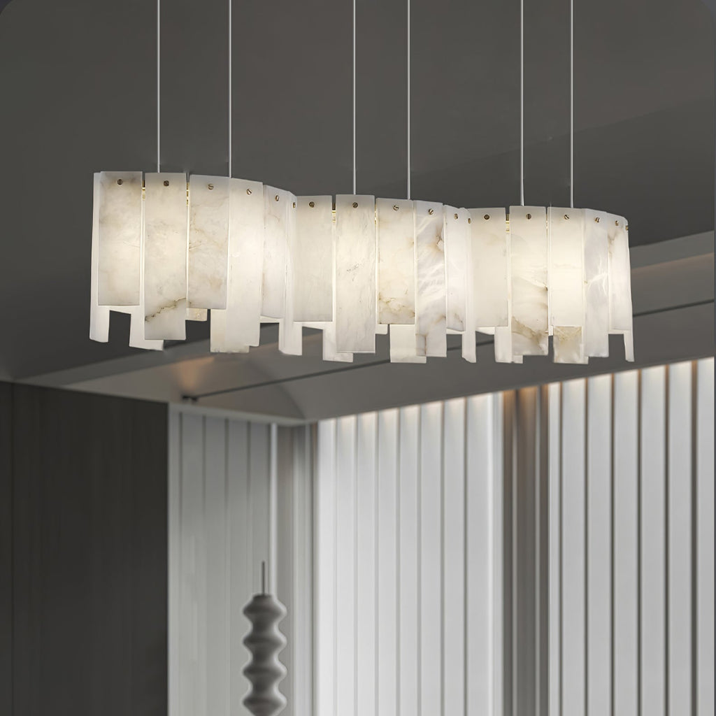 Arctora Alabaster Pendant Lamp — product setting and fixture profile, vertical stone panels arranged around a suspended frame (view 2)