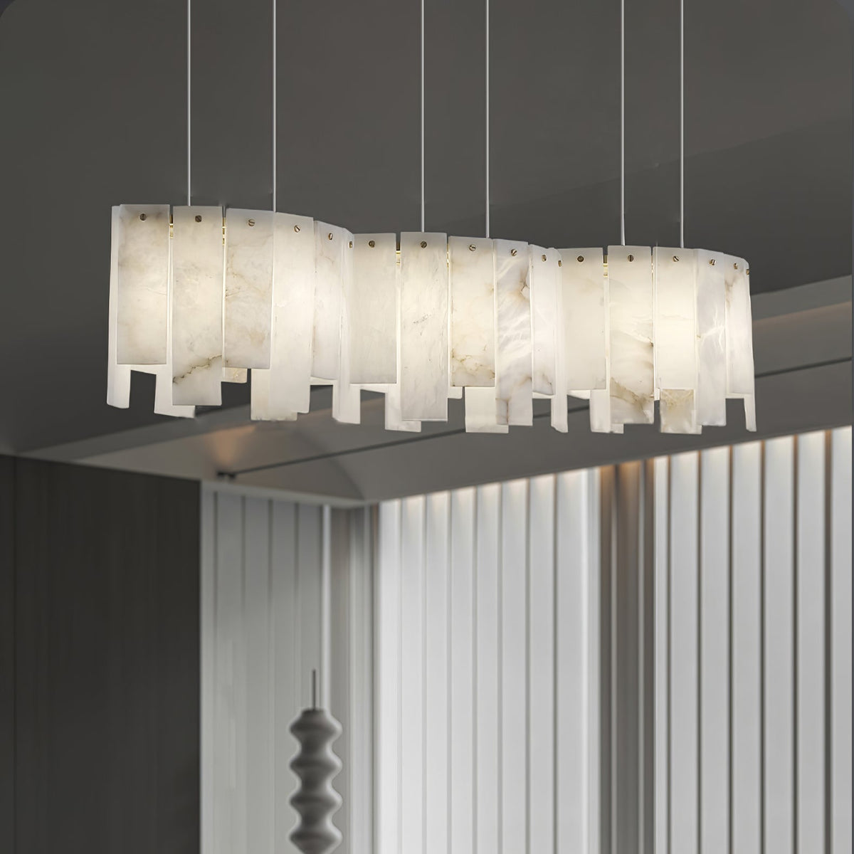 Arctora Alabaster Pendant Lamp — product setting and fixture profile, vertical stone panels arranged around a suspended frame (view 2)