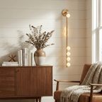 Asteria Alabaster Multi-Globe Wall Sconce — product setting and fixture profile, stone orbs arranged around a slender vertical body (view 2)