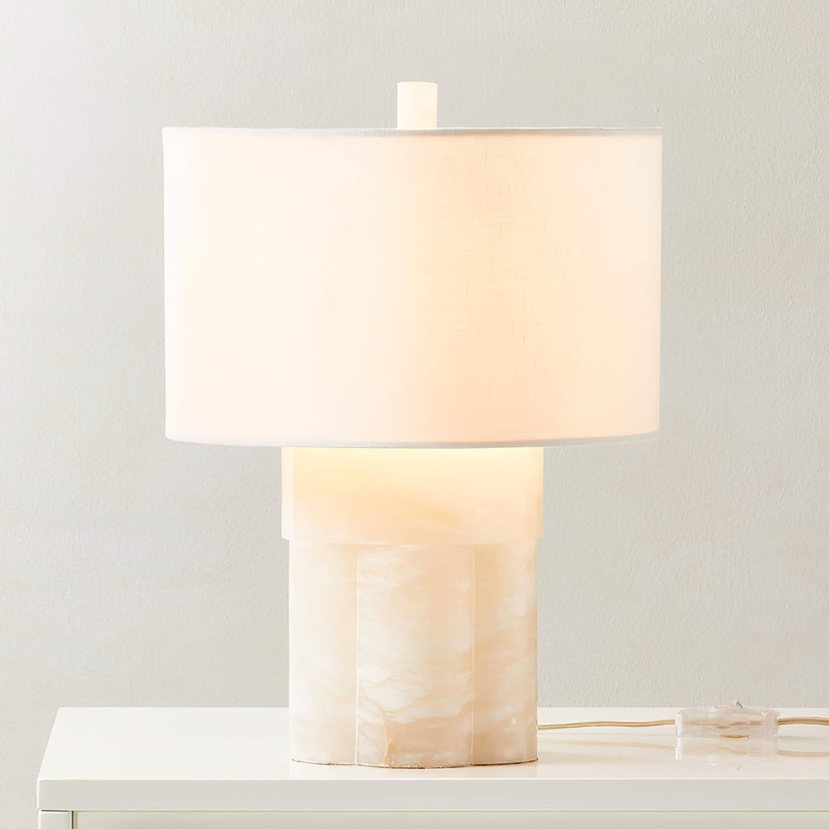 Athena Alabaster Table Lamp — product setting and fixture profile, a stone base beneath a fabric drum shade (view 2)