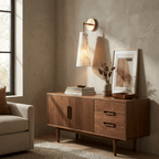 Aurelia Alabaster Cone Wall Sconce — product setting and fixture profile, an elongated stone cone on a refined metal wall arm (view 2)