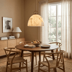 Aurelian Alabaster Dome Pendant Light — additional product view, a bell-shaped stone dome beneath an arched suspension fitting (view 5)