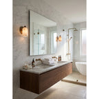 Bombelles Alabaster Wall Lamp — additional product view, a domed stone shade against a round metal backplate (view 3)