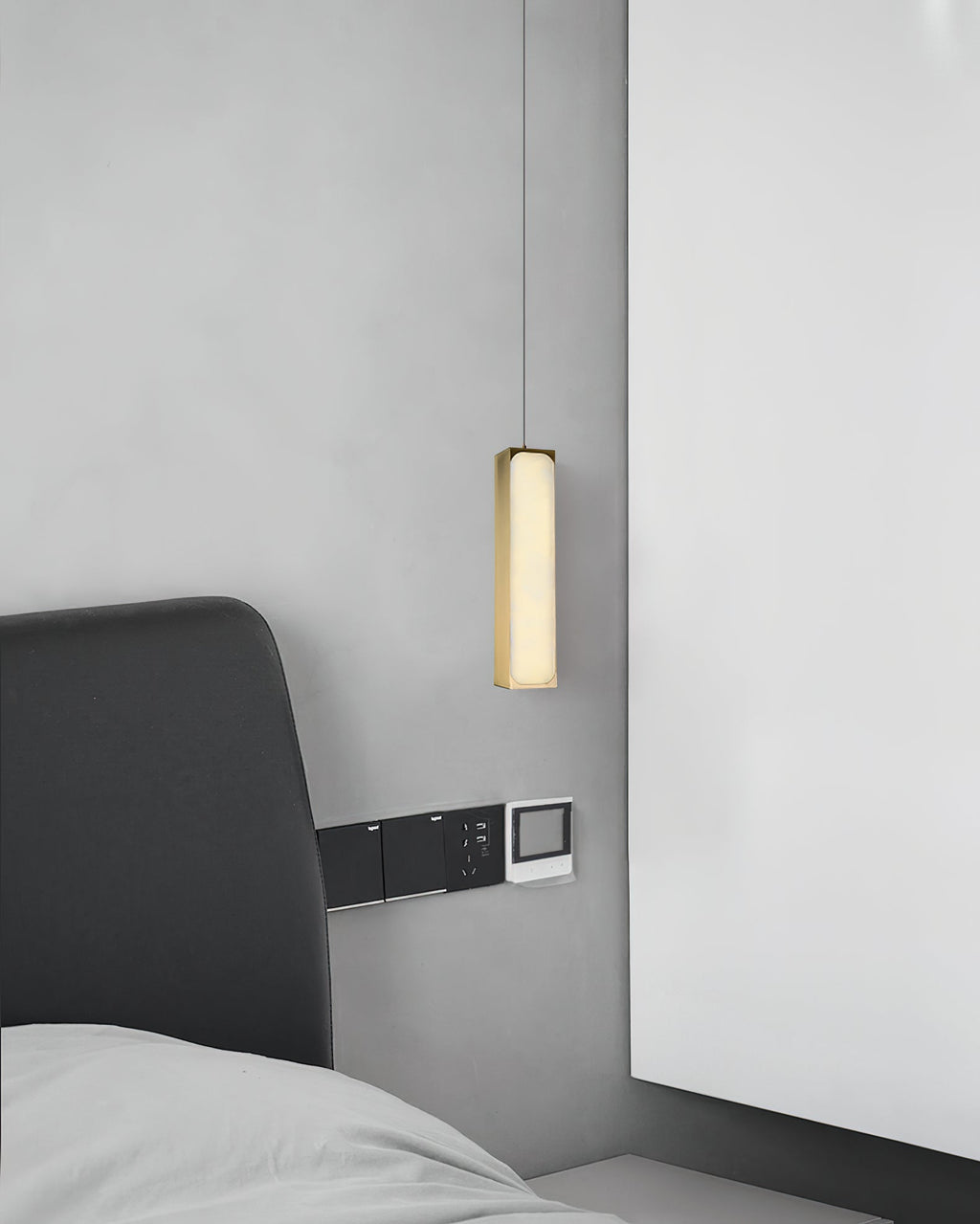 Chaos Alabaster Pendant Light — additional product view, a slender stone cylinder suspended on fine cables (view 4)