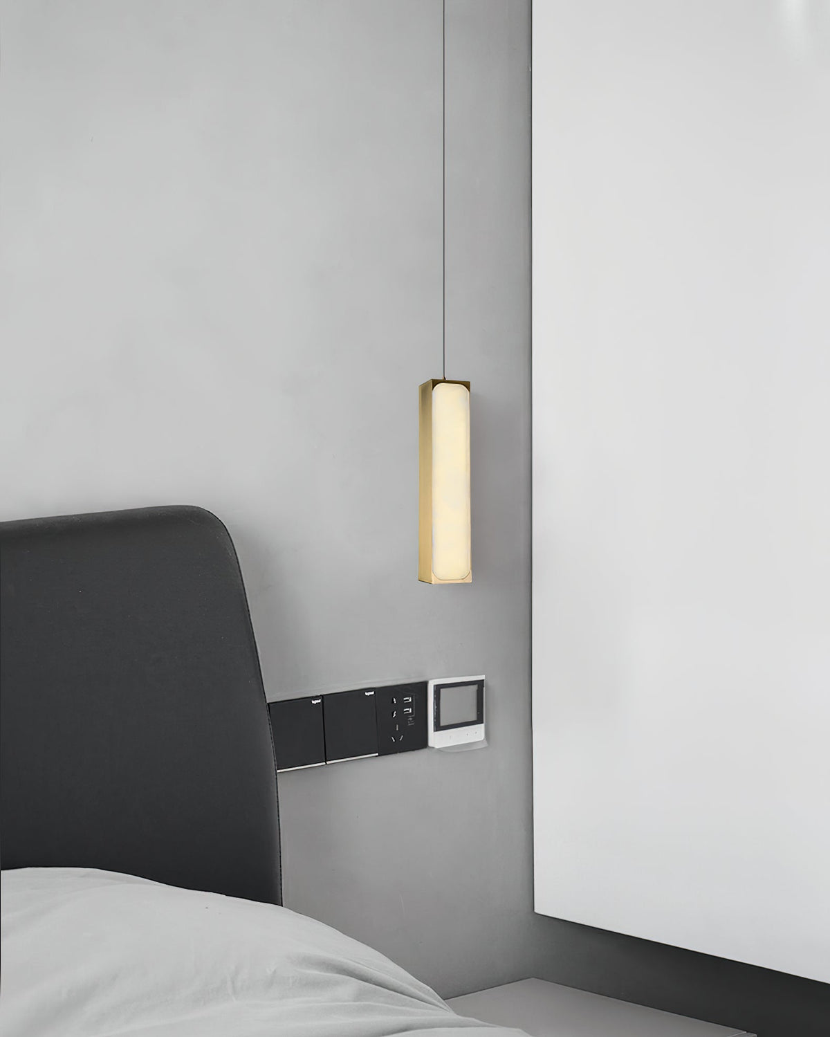 Chaos Alabaster Pendant Light — additional product view, a slender stone cylinder suspended on fine cables (view 4)