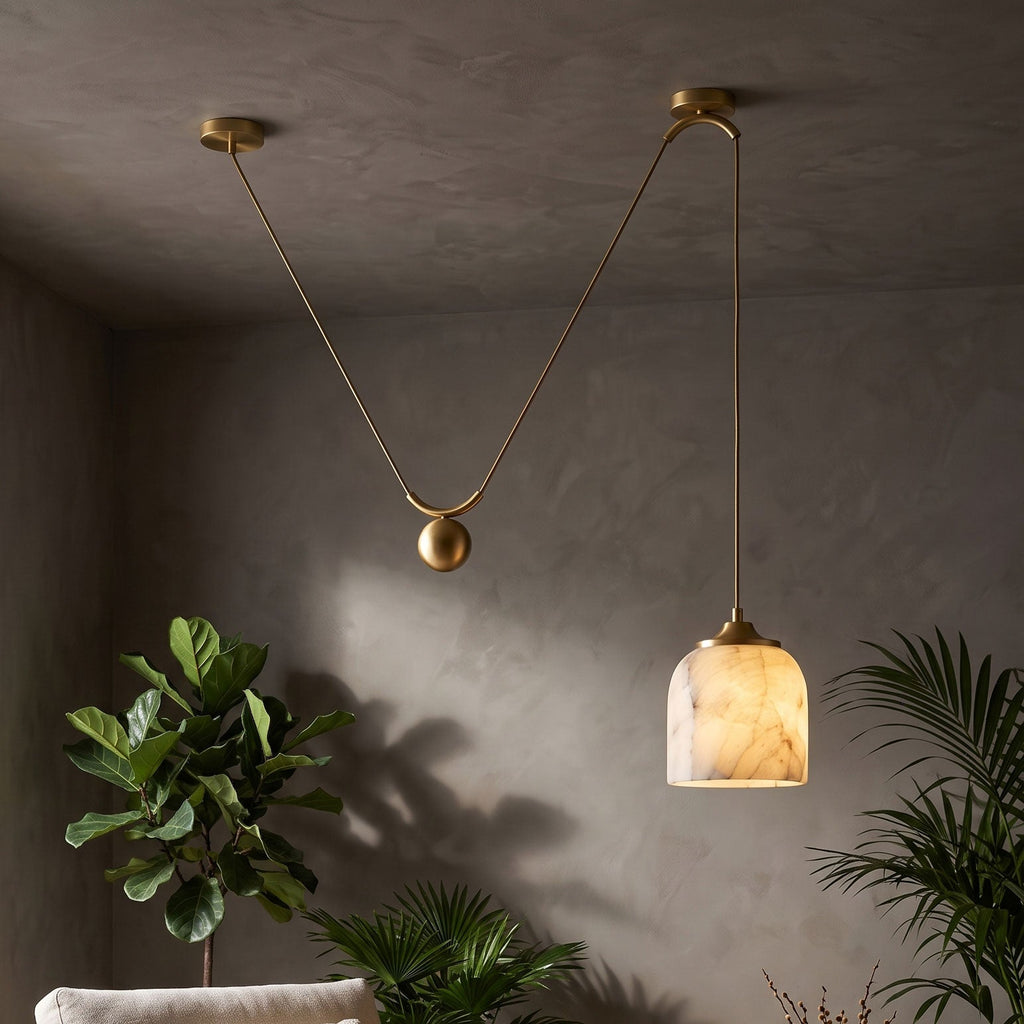 Chart Alabaster Counterweight Pendant Lamp — product setting and fixture profile, a stone shade suspended with a counterweight system (view 2)