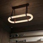 Circle Alabaster Chandelier — additional product view, an elongated stone loop suspended by leather-look straps (view 4)