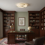 Clocks Alabaster Ceiling Light — product setting and fixture profile, a circular stone face crossed by clock-hand-like metal accents (view 2)