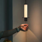 Cylindrical Plinth Alabaster Pendant Lamp — product setting and fixture profile, a stone cylinder above a dark metal plinth (view 2)