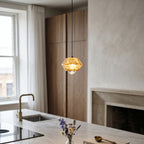 Diamante Alabaster Pendant Lamp — product setting and fixture profile, a faceted stone body with a crystal detail at its base (view 2)