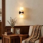 Dual Alabaster Ribbed Wall Sconce — product setting and fixture profile, two ribbed stone shades on a metal wall mount (view 2)