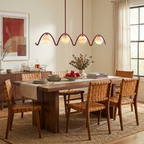Festoon Alabaster Chandelier — product setting and fixture profile, four globe shades along a continuous scalloped metal tube (view 2)