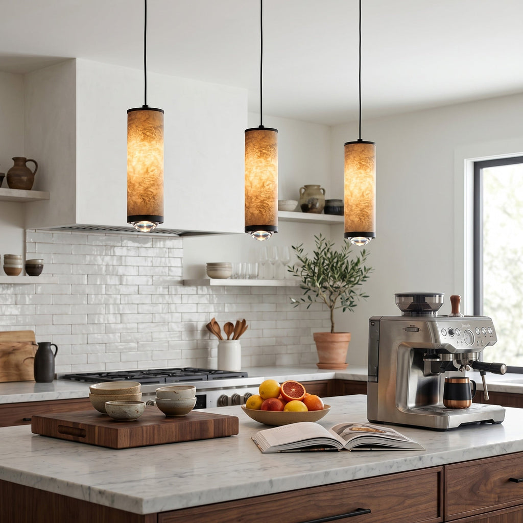 Three Fina cylindrical pendants installed above a kitchen island
