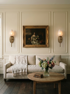 Floriane Alabaster Tulip Wall Sconce — product setting and fixture profile, a tulip-shaped stone shade above a slender torch stem (view 2)