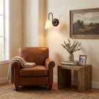 Heron Alabaster Wall Sconce — product setting and fixture profile, a downward-facing stone cone beneath a tall curved arm (view 2)