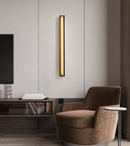 Isolde Alabaster Wall Sconce — product setting and fixture profile, a smooth stone diffuser on a compact metal wall mount (view 2)