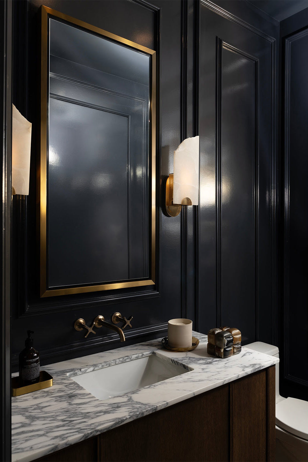 Jonah Alabaster Wall Lamp — product setting and fixture profile, a stone diffuser with an uneven broken-edge outline (view 2)