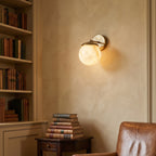 Lark Julep Alabaster Wall Sconce — product setting and fixture profile, a stone globe beneath a brass cap (view 2)
