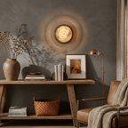 Orlina Stone Disc Wall Sconce — product setting and fixture profile, a shallow circular stone diffuser on a metal wall mount (view 2)
