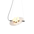 Magma Alabaster Pendant Lamp — full fixture profile, stone discs within a dark metal frame (view 1)