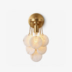 Magnolia Alabaster Disc Sconce — full fixture profile, five stone discs suspended beneath a round wall plate (view 1)