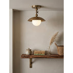 Marie Petite Hammer Pattern Flush Mount — additional product view, a stone globe beneath a textured brass dome (view 3)