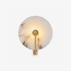 Medallion Alabaster Wall Sconce — full fixture profile, a round stone disc crossed by an angular metal arm (view 1)