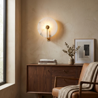 Medallion Alabaster Wall Sconce — additional product view, a round stone disc crossed by an angular metal arm (view 5)
