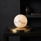 Mini Alabaster Moon Table Lamp — additional product view, a rounded stone shade accented by a brass disc (view 3)