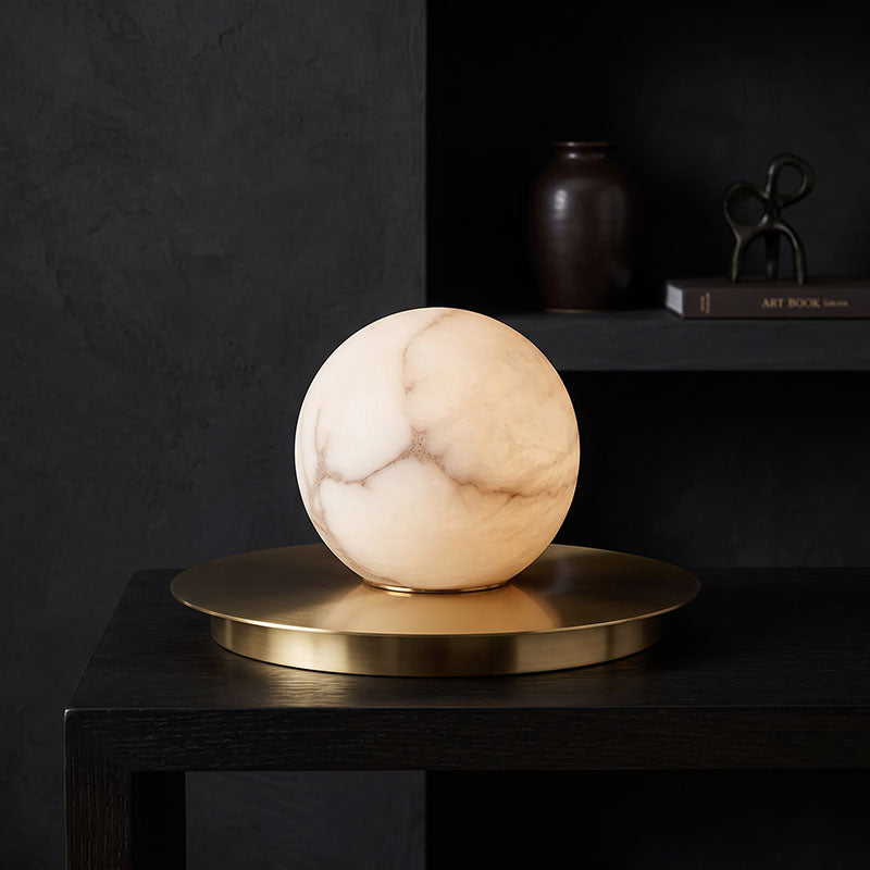 Mini Alabaster Moon Table Lamp — additional product view, a rounded stone shade accented by a brass disc (view 3)