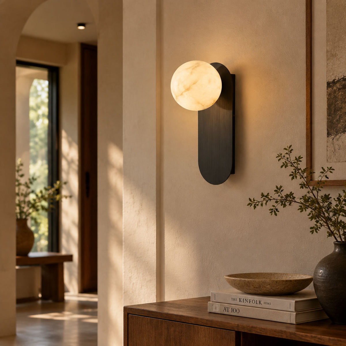 Mira Alabaster Globe Wall Sconce — product setting and fixture profile, a rounded stone shade on a compact vertical mount (view 2)