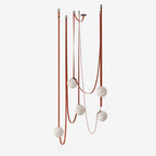 Multiple Belt Alabaster Pendant Light — full fixture profile, rounded stone shades suspended from individual leather or canvas straps (view 1)