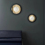 Ophela Alabaster Sconce — product setting and fixture profile, a carved stone shade on a brass wall backplate (view 2)