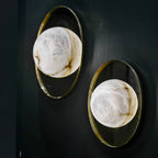 Ophela Alabaster Sconce — additional product view, a carved stone shade on a brass wall backplate (view 3)
