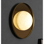 Ophela Alabaster Sconce — additional product view, a carved stone shade on a brass wall backplate (view 4)