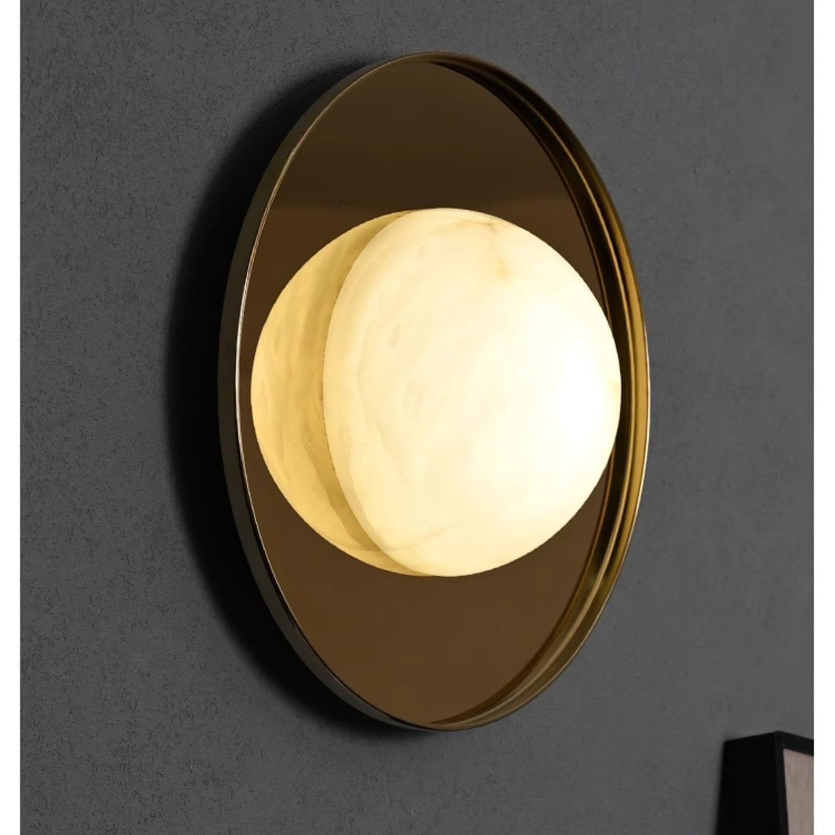 Ophela Alabaster Sconce — additional product view, a carved stone shade on a brass wall backplate (view 4)