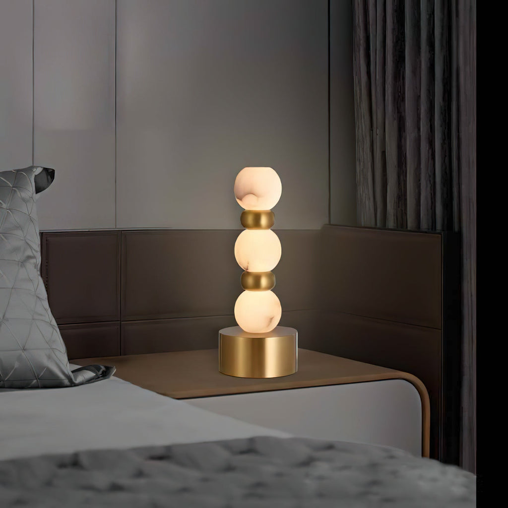 Pearl Xyx Alabaster Table Lamp — additional product view, three rounded stone forms above a metal base (view 3)