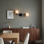 Perigee Alabaster Wall Sconce — additional product view, two stone globes carried by a slim metal arm (view 3)