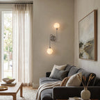 Perigee Alabaster Wall Sconce — additional product view, two stone globes carried by a slim metal arm (view 5)