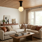 Pestle globe ceiling light installed in a living room with a wood ceiling