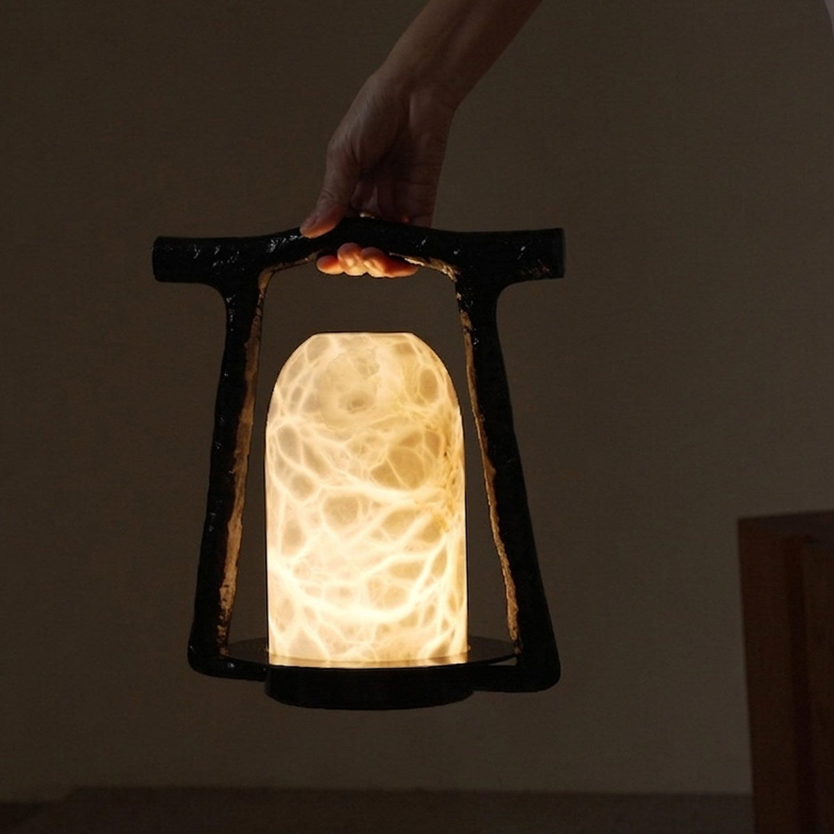 Portal Alabaster Table Lamp — product setting and fixture profile, a stone dome set within an open bronze arch (view 2)