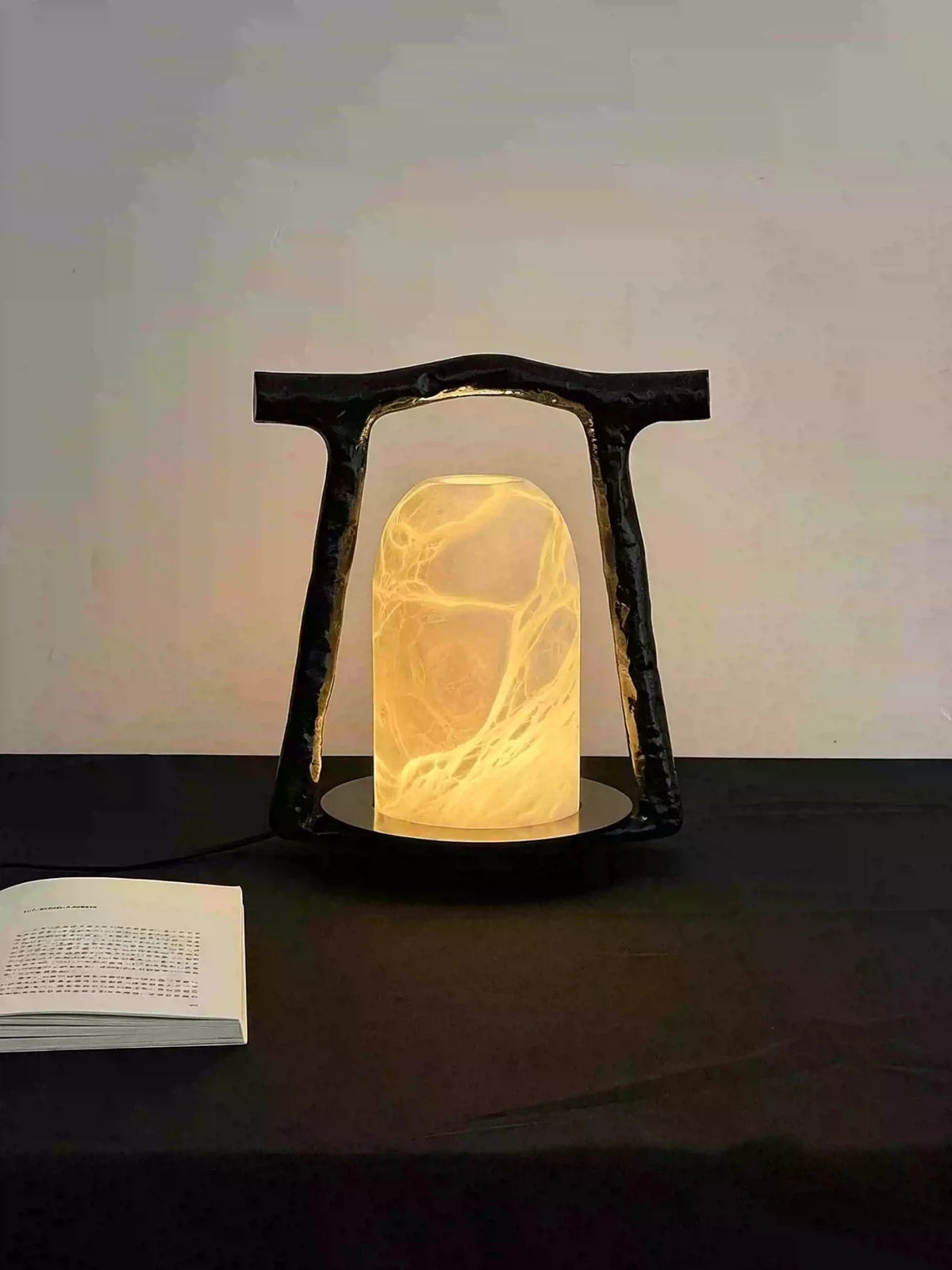 Portal Alabaster Table Lamp — additional product view, a stone dome set within an open bronze arch (view 3)
