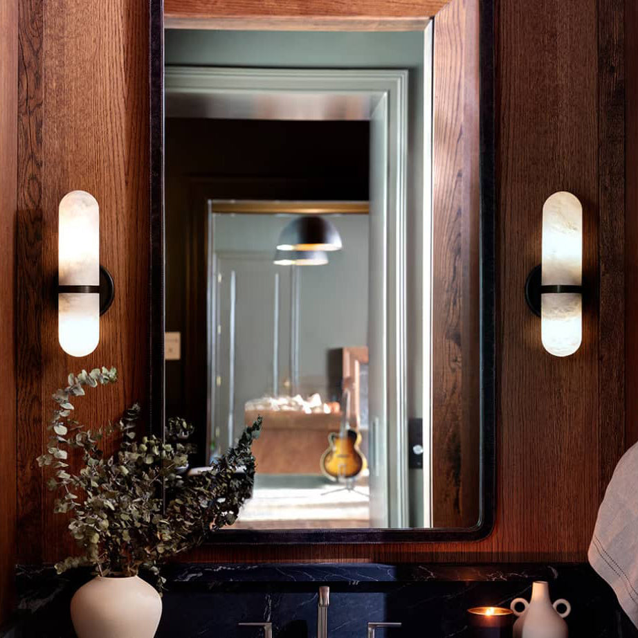 Salon Alabaster Wall Lamp — product setting and fixture profile, a rounded cylindrical stone shade on a compact wall frame (view 2)