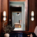 Salon Alabaster Wall Lamp — product setting and fixture profile, a rounded cylindrical stone shade on a compact wall frame (view 2)
