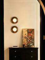 Selene Alabaster Moon Wall Sconce — product setting and fixture profile, an off-center stone sphere on a wall-mounted frame (view 2)