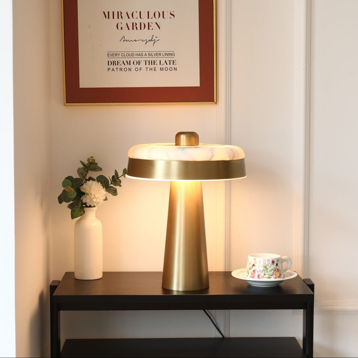 Solis Alabaster Disc Table Lamp — product setting and fixture profile, a flat stone disc above a tapered metal column (view 2)