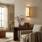 Strivane fluted wall sconce installed on a light-colored living room wall