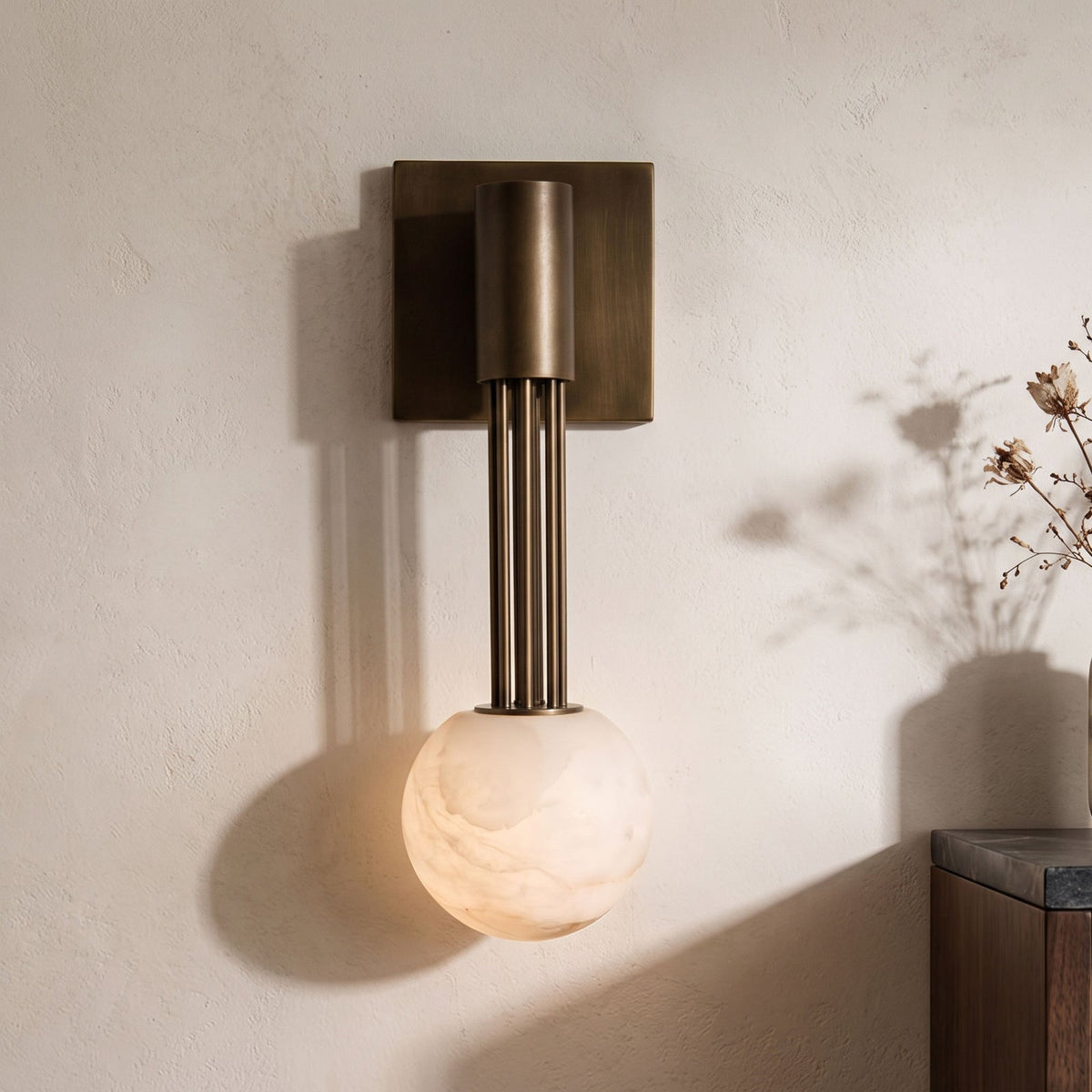 Thalorien Wall Sconce — product setting and fixture profile, a stone globe with antique bronze fittings (view 2)