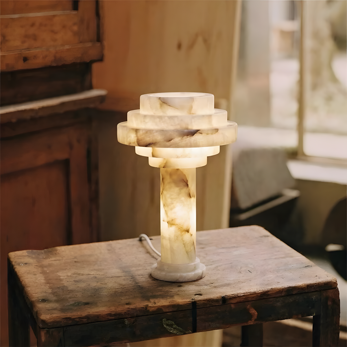 Tieralith Alabaster Table Lamp — product setting and fixture profile, a tiered stone lamp body with a geometric profile (view 2)